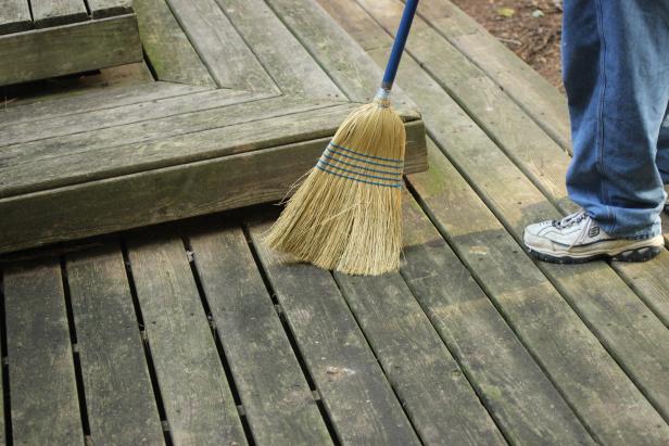 Clear any furniture or plants from the deck, grab a broom and clear off  surface debris. As you traverse the deck, make note of any split,  splintered or rotting lumber, raised screws or nails, rusted hardware  and any other problems which will need to be addressed.