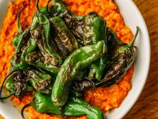 This flavorful recipe matches the tang of Romesco with the satisfying snap of fried shishito peppers.
