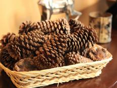 Pine cones are an inexpensive way to decorate seasonally. Arranged in a basket or vase by the front door, they invoke the holidays without putting out the hardcore Christmas decorations before a flake of snow has been forecast. Up the warm and cozy factor this year with DIY cinnamon-scented pine cones.