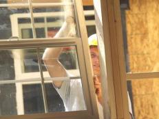 Construction Worker Installing Window
