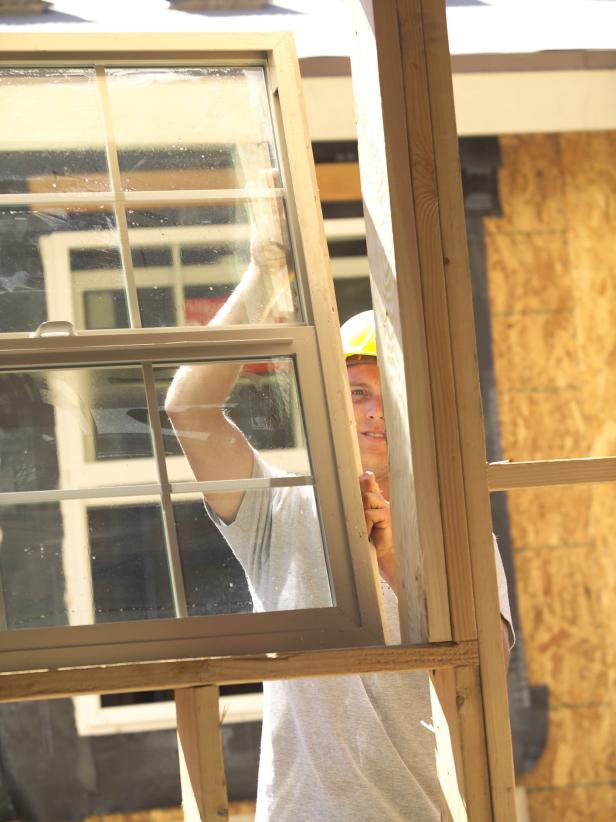 Construction Worker Installing Window