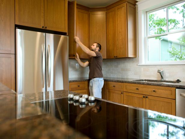 Contractor working on cabinets in new home