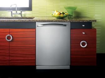 Modern Kitchen With Stainless Steel Dishwasher and Green Backsplash