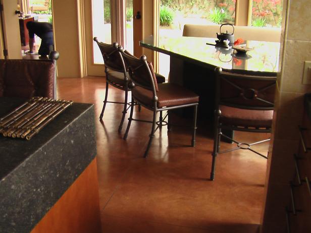Open Dining Room With Brown Concrete Floor & Metal Chairs