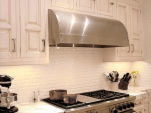 Stainless Steel Gleams in All White Kitchen