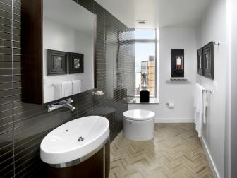 Dark Gray Glass Tile Wall and Sleek Vanity in Modern White Bathroom