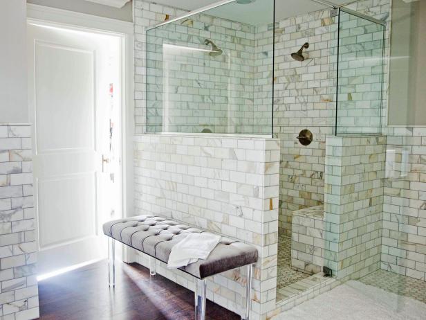 Bathroom With White Marble and Glass Enclosed Shower Stall