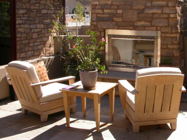 A seating area in front of an outdoor propane fireplace.