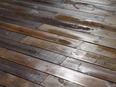 A detail shot of a wet clean wood deck.