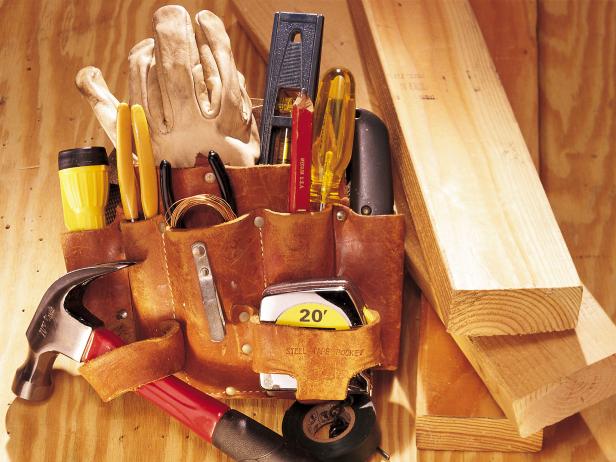 A still life of lumber and tool belt materials used for building a wood deck.