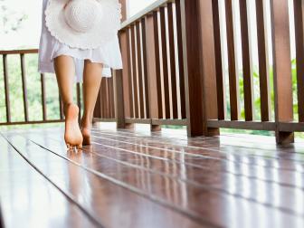 Woman walking on a clean deck that has been pressure washed.