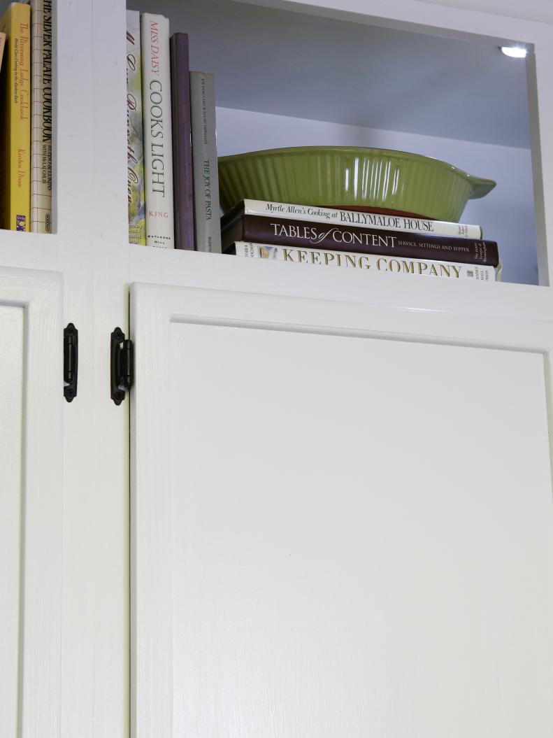 Cookbook storage above cabinet