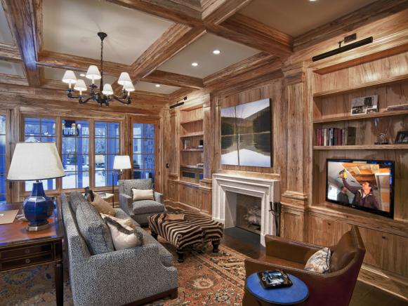 Exposed woods and nature inspired artwork lend a timeless feel to a living room that is outfitted with the latest in entertainment and control technology.