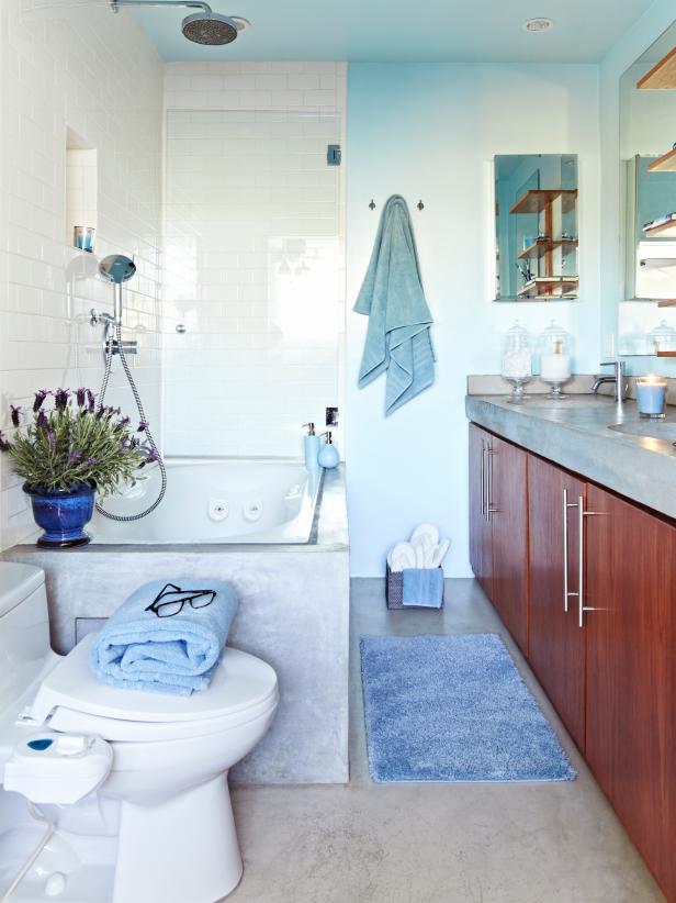 Transitional Blue Bathroom With White Subway Tile Wall Above Bathtub
