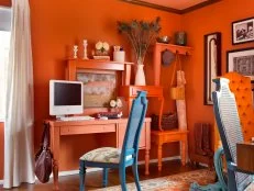 Eclectic Orange Home Office With Custom Storage and Display Area