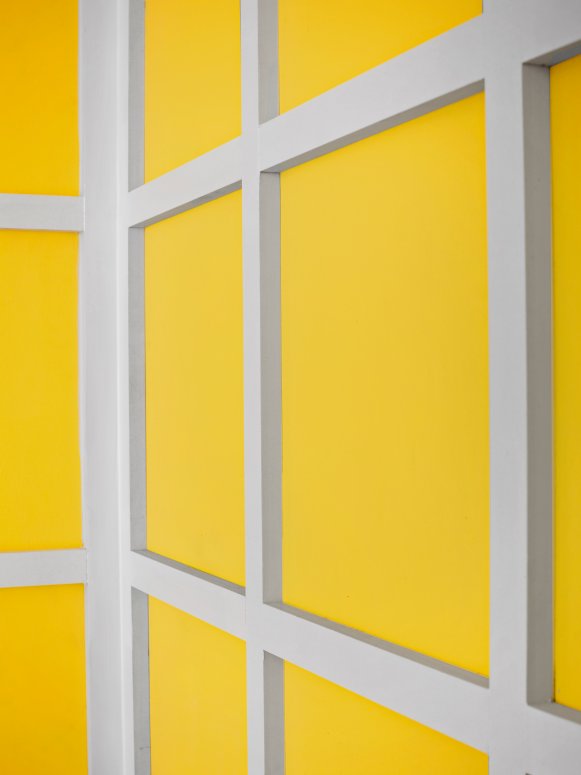 Yellow Dining Room Walls with White Paneling 