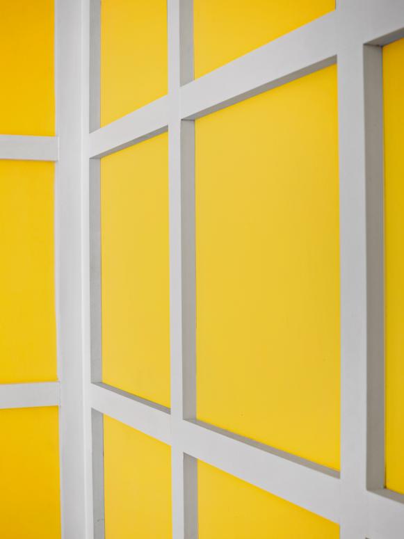 Yellow Dining Room Walls with White Paneling 
