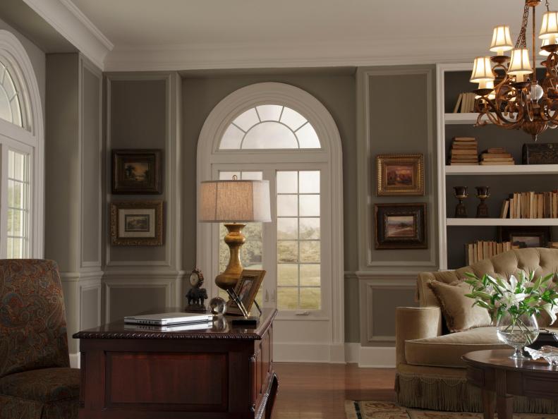 Home Office With Arched Windows, Oil Paintings, Wood Desk