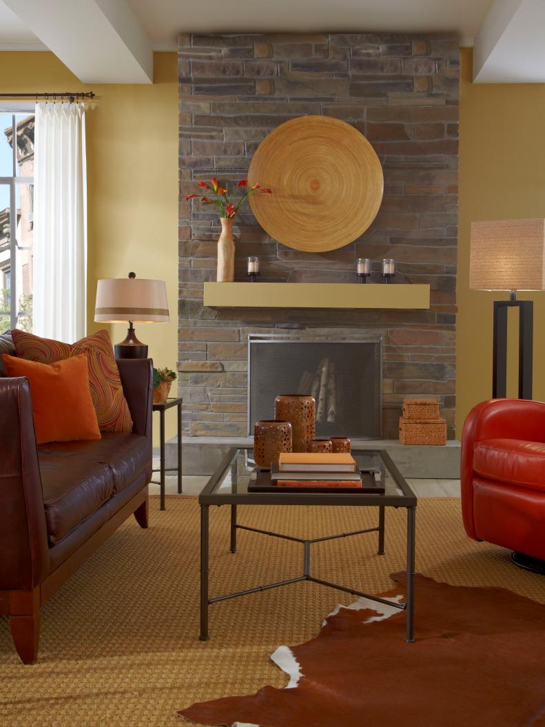 Burnt Orange Touches in Contemporary Living Room With Stone Fireplace