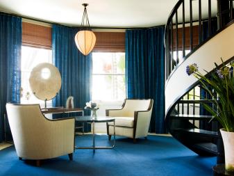 Blue Sitting Area with Brown Spiral Staircase 