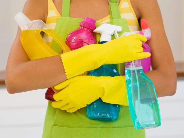 Woman with cleaning supplies
