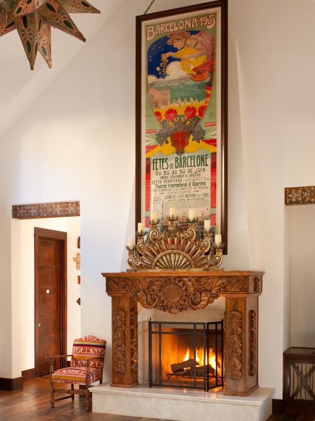 Carved mantel with large poster over it
