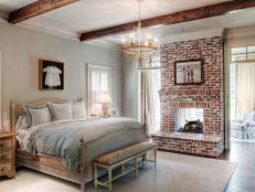 Brick Fireplace in Bedroom with Exposed Beams
