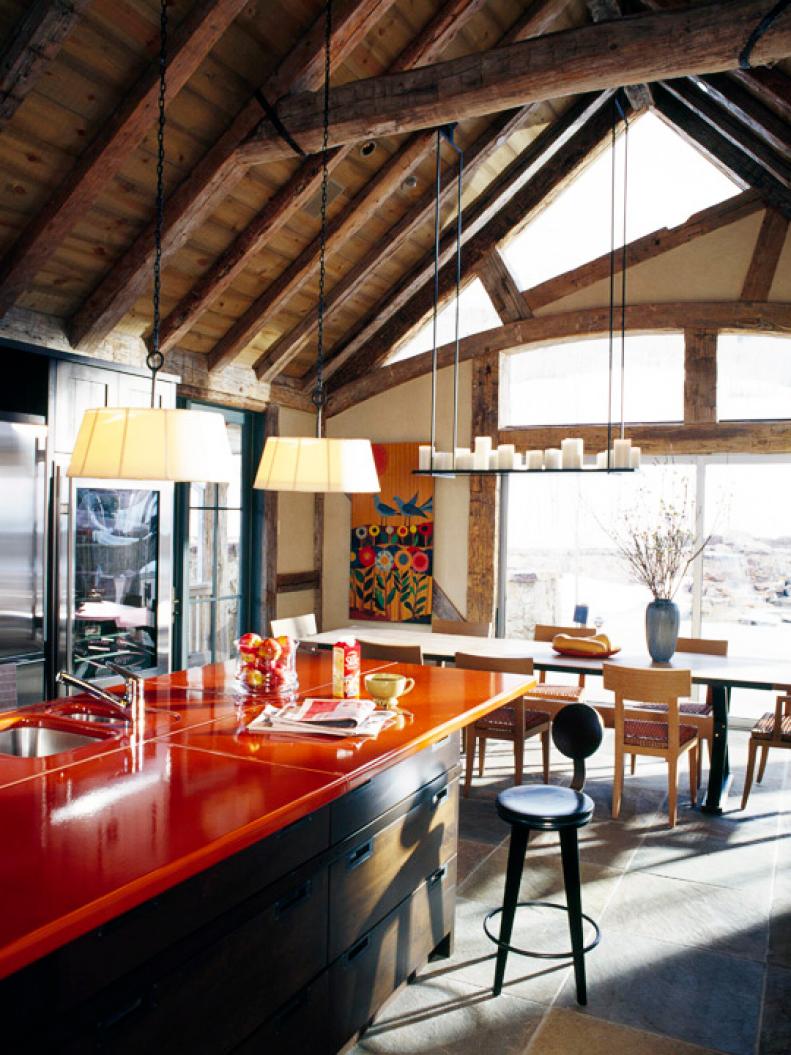 Kitchen with wood ceiling and orange counter-tops. 