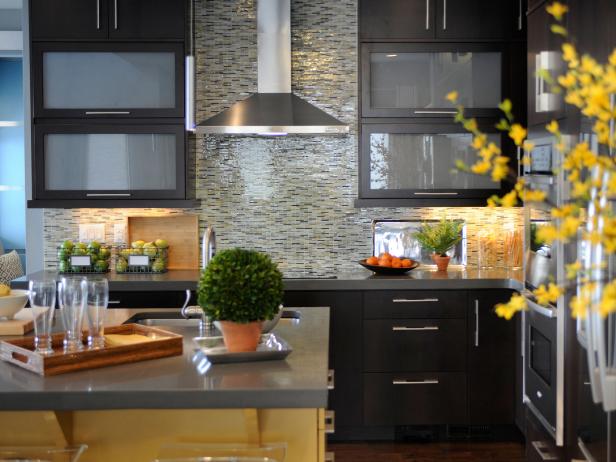 The HGTV Green Home 2011 is  an exquisite modern prairie style home in beautiful Denver, Colorado. It features contemporary furnishings and fixtures with rugged western nods. Pictured are the kitchen cabinets, island and vent hood.