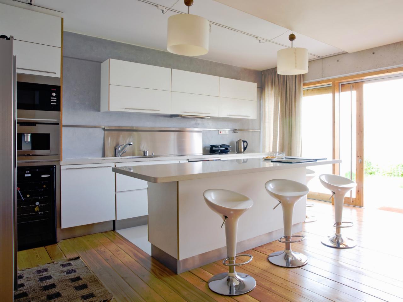 white kitchen island with storage and seating