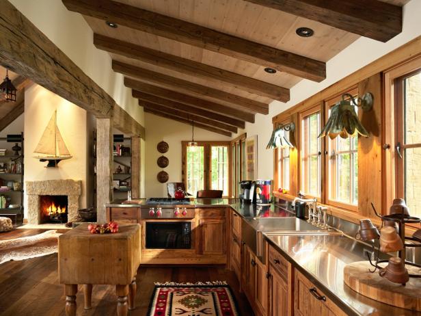Exposed Ceiling Beams in a Brown Kitchen 