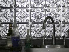 Tin metal backsplash with faucet and sink area.  Photo Credit: Susan Cato