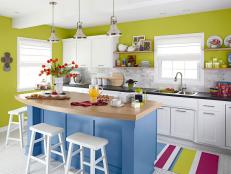 Sunny Kitchen with White Cabinets and Blue Island