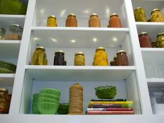 A detail shot of Green Home 2008, white pantry shelving with jars.