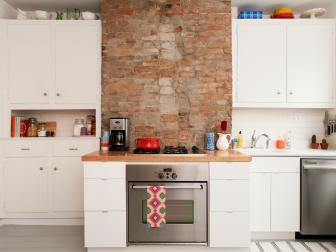 Small White Kitchen with Brick Backsplash 