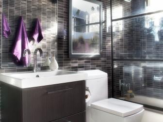 Bathroom With Gray Tile Walls, Floating Vanity and Square Toilet