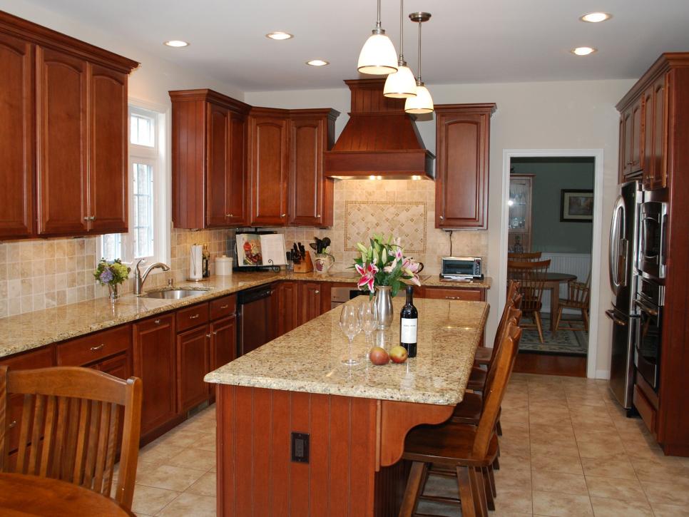 grey granite countertops with brown cabinets