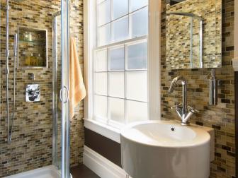 Neutral Bathroom with a Large Window and Lighting Over a Mirror. 