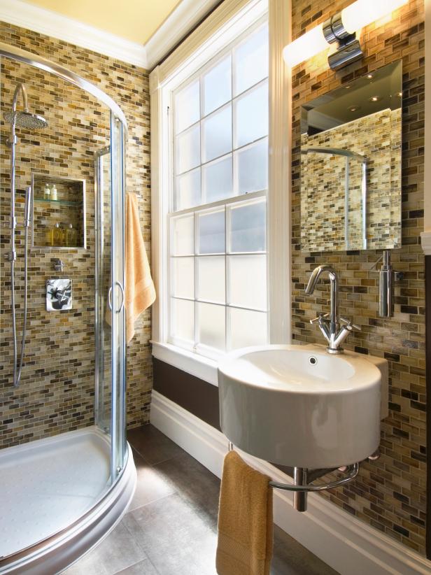 Neutral Bathroom with a Large Window and Lighting Over a Mirror. 
