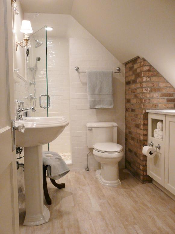 Small Neutral bathroom with Brick Backsplash. 