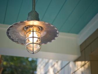 Front yard of the HGTV Smart Home 2013 located in Jacksonville, FL. Closeup of an antique light fixture on the patio. 