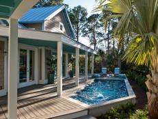 The pool carves out a defining feature in the backyard with design elements that reference interior details.
