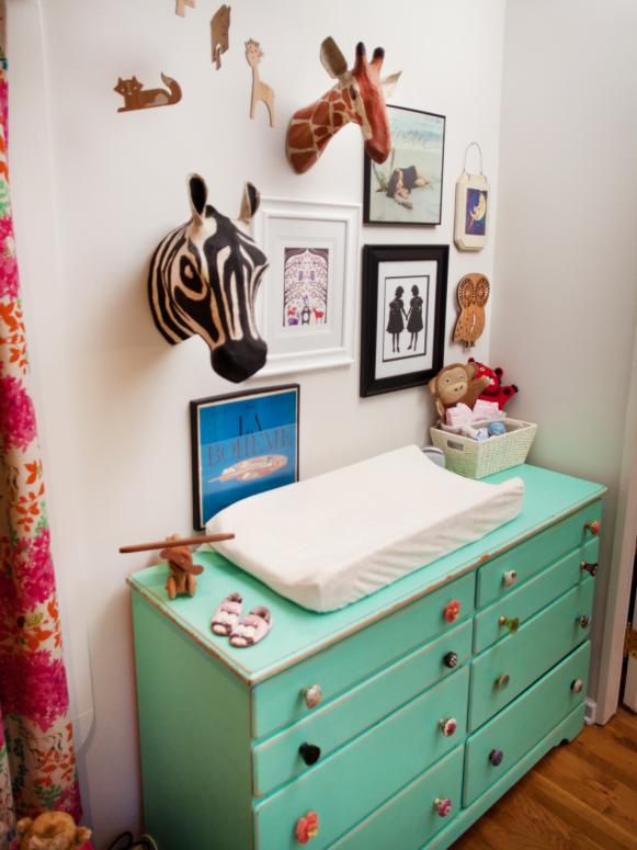 Nursery With Eclectic Gallery Wall and Mint Green Changing Table