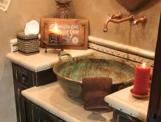 The vanity in this particular bathroom offers an antique copper sink where cowboys and cowgirls can refresh themselves after spending time in the D and D Saloon.
