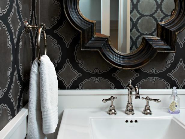 No matter how small a space; it can be visually stunning. In this small powder room, the mirrored shapes and hard and soft colors make it a unique space.