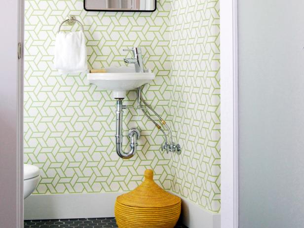 A tiny powder room in a San Francisco Victorian is updated with graphic wallpaper and contemporary fixtures.