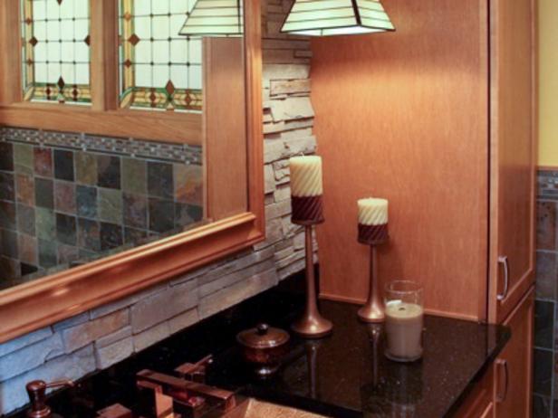 Arts & Crafts style with granite vanity top, hammered copper sink and polished copper fixtures. Back splash is stacked ledge stone.