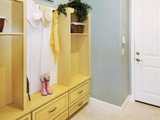 The double halltree is the perfect piece for this mudroom.  Pastel color walls and light wood give an open airy feel to this informal entry.