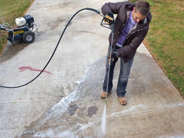 Protect hands with safety gloves, then apply detergent by holding down spray handle, keeping a consistent distance of 8 to 18-inches from concrete. Work your way back and forth in a smooth, controlled manner, overlapping each stroke by 6 to 8 inches. Let sprayed detergent sit on surface for 5 minutes.