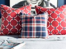 Many fabric manufacturers take classic nautical prints and enlarge the scale as much as 300% to create something true to its original form, but modern in size. The red, white and blue geometric fabric used in this pair of pillows was drastically increased to put a fresh spin on a timeless pattern.